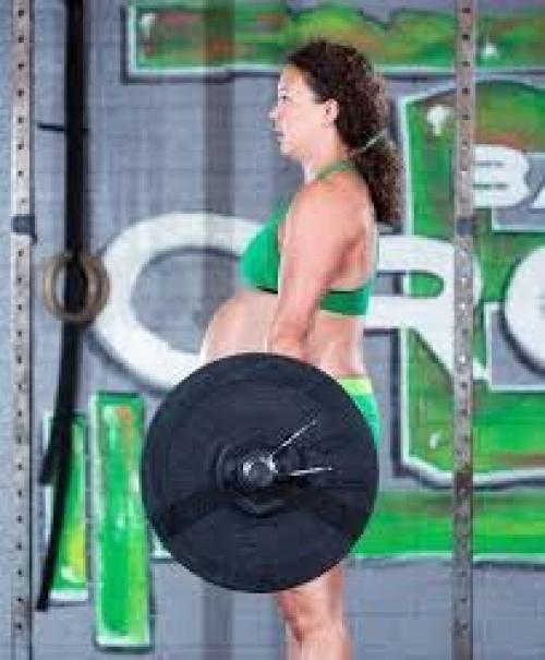 33-Летняя Меган лазерман продолжила заниматься тяжёлой атлетикой и на девятом месяце беременности! 01